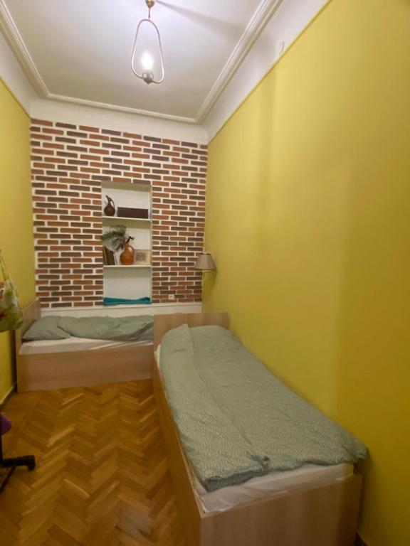 Postel nebo postele na pokoji v ubytování Hostel ERA
