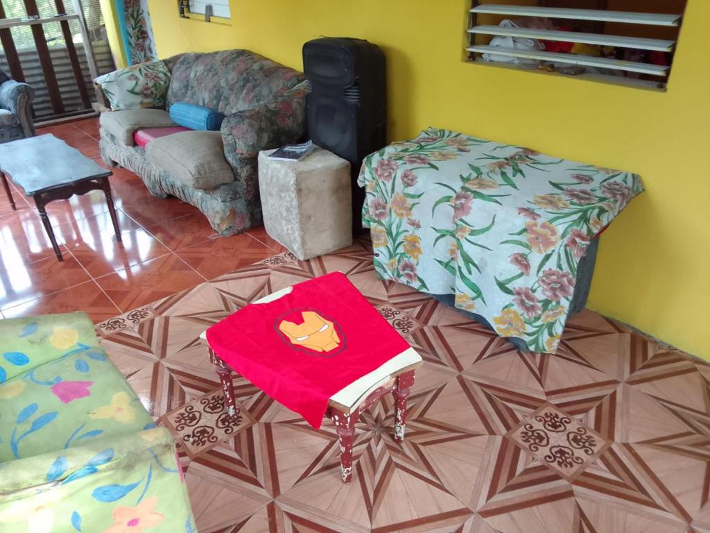 a living room with a couch and a chair at Eden Palace in Montego Bay