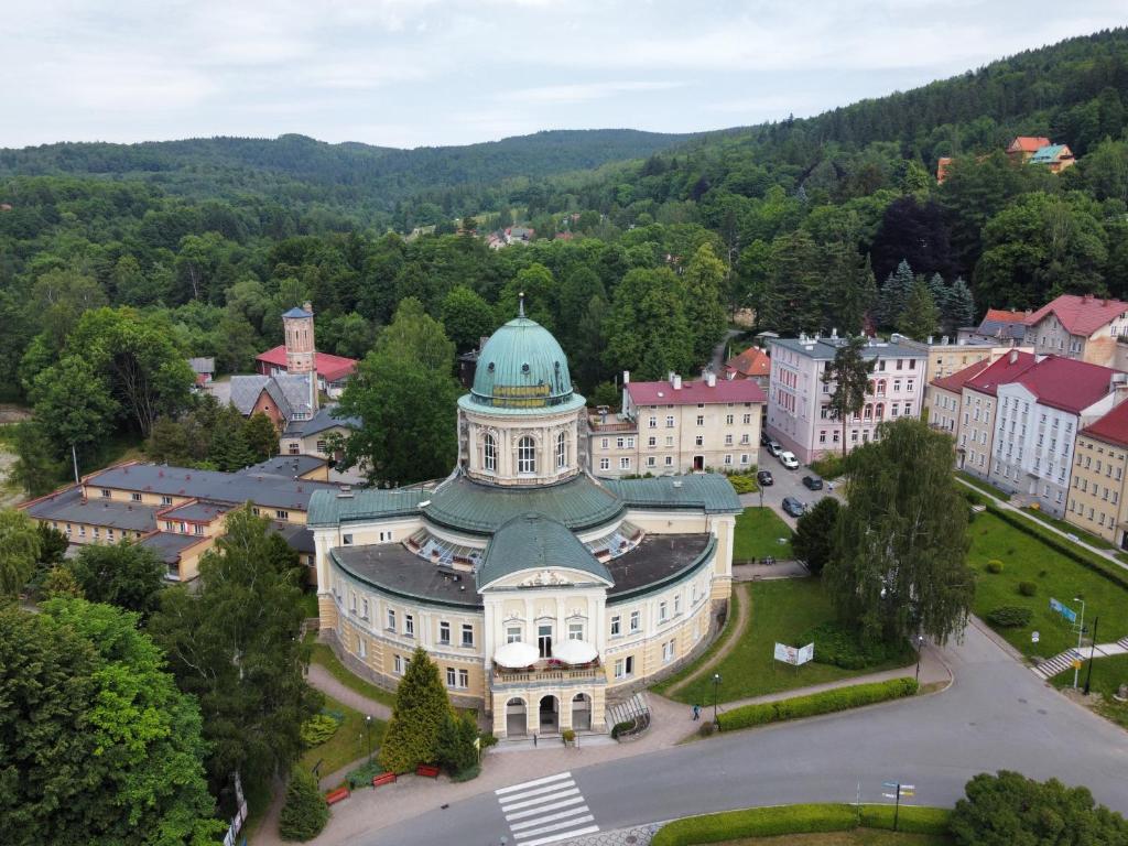 an aerial view of a building with a green dome at StronSki Apartament in Stronie Śląskie
