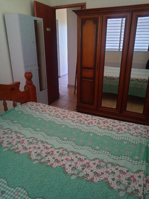 Postel nebo postele na pokoji v ubytování Mornes Caraïbes