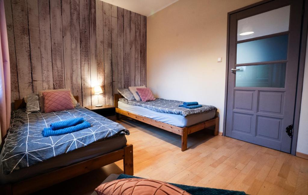 Posteľ alebo postele v izbe v ubytovaní Cze Chill House - Dom na Kaszubach