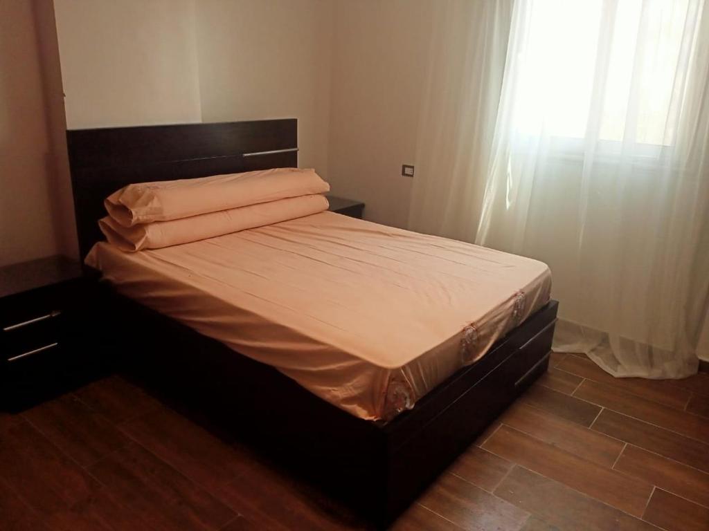 Ένα ή περισσότερα κρεβάτια σε δωμάτιο στο LovelyPlace