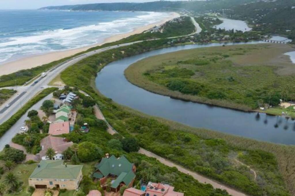an aerial view of a house next to a beach at Wilderness deckhouse. views!/sun/sea/river/kayaks in Wilderness