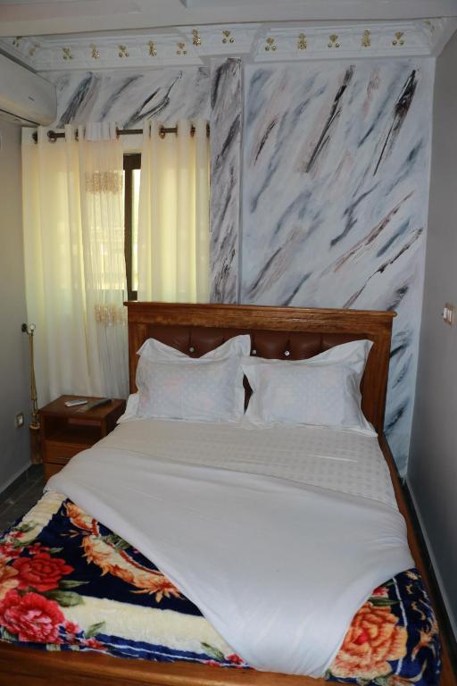 Postel nebo postele na pokoji v ubytování DEUDJUI HOTEL