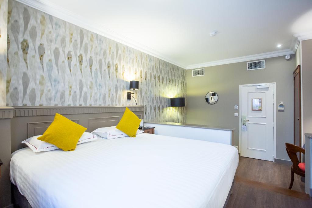 Postel nebo postele na pokoji v ubytování Best Western Plus Hôtel D'Angleterre