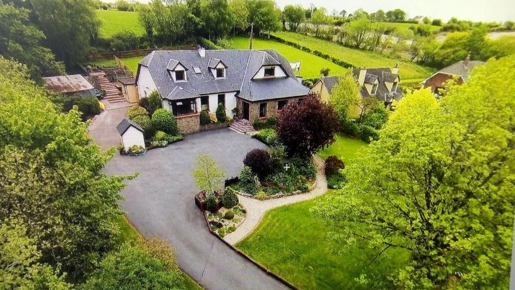 an aerial view of a house with a driveway at Fort William, Dripsey 