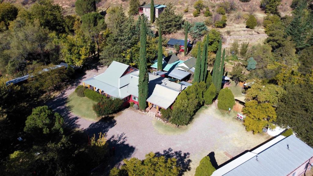 an aerial view of a house with a group of trees at Mile High Ranch in Bisbee