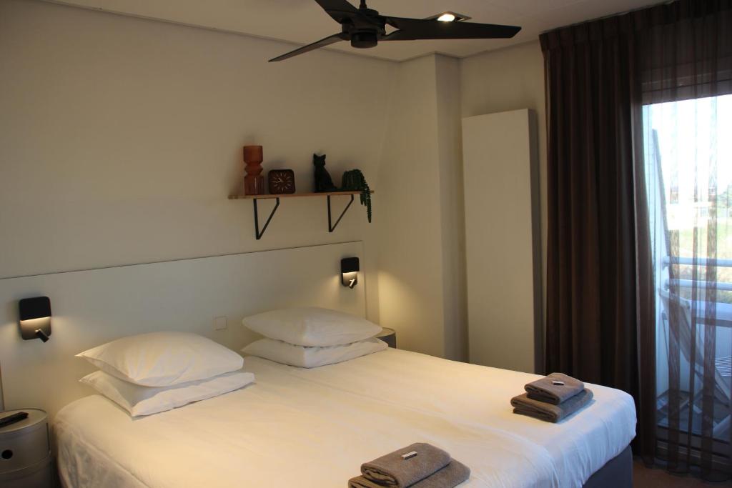 Postel nebo postele na pokoji v ubytování Hotel Hogerhuys - adults only