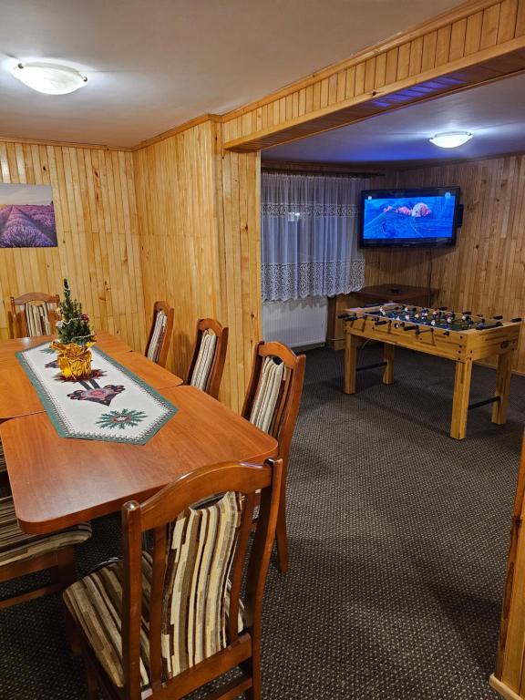 a dining room with a table and a chess board at Hostel Wielka Krokiew in Zakopane