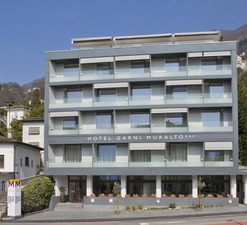 a hotel building with the words hotel gandan hôtel at Hotel Garni Muralto in Locarno