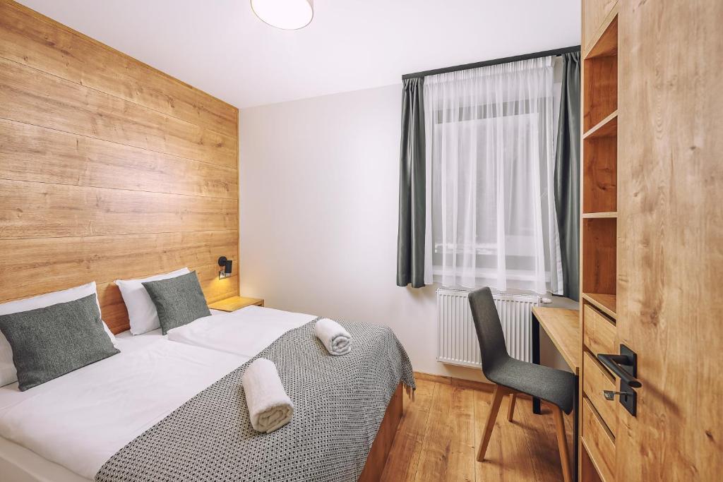 Postel nebo postele na pokoji v ubytování Resort Lucky Jasna
