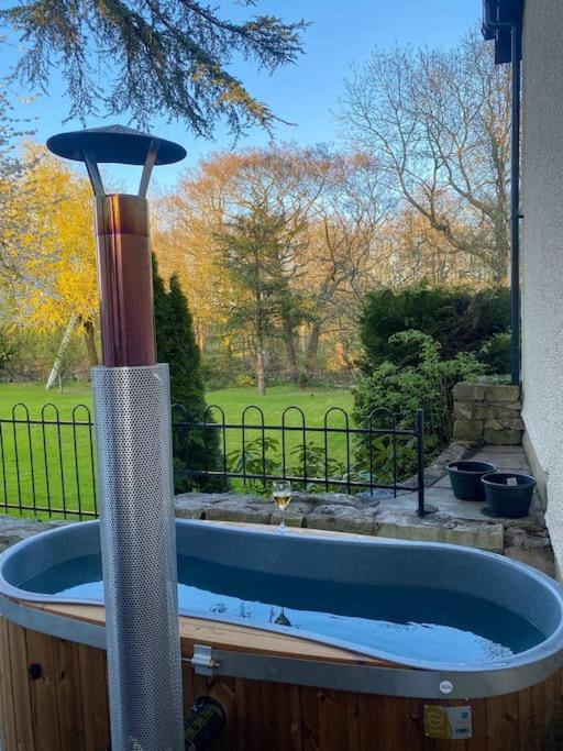 a jacuzzi tub in front of a window at Luxurious & Tranquil staycation - w/ Hot Tub! in Burneside