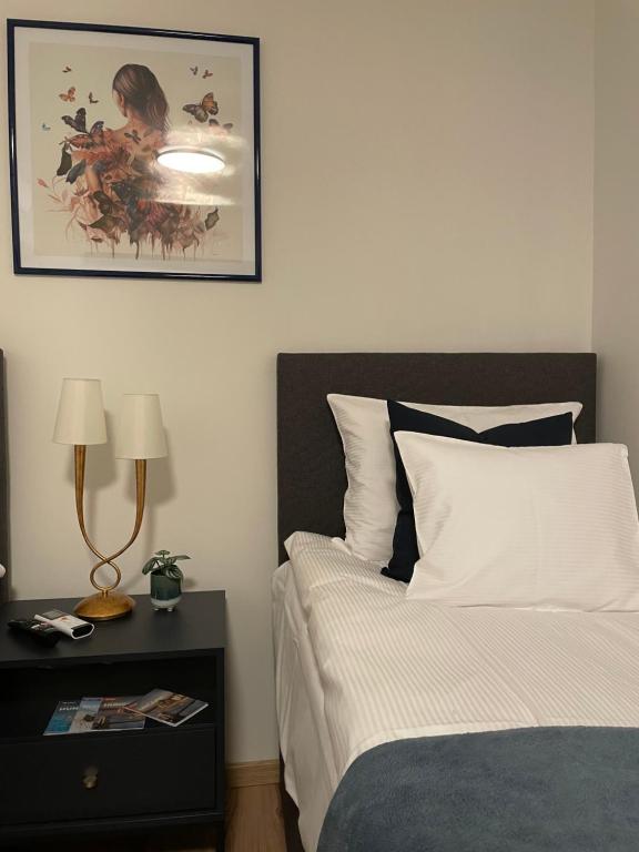 Postel nebo postele na pokoji v ubytování NOER apartman