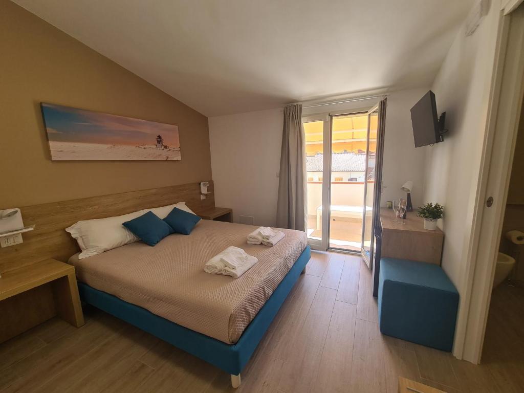 Giường trong phòng chung tại B&B Al Quadrato