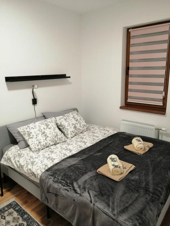 A bed or beds in a room at Divčinova S4