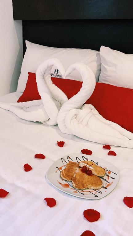 Postel nebo postele na pokoji v ubytování Hotel Imperial
