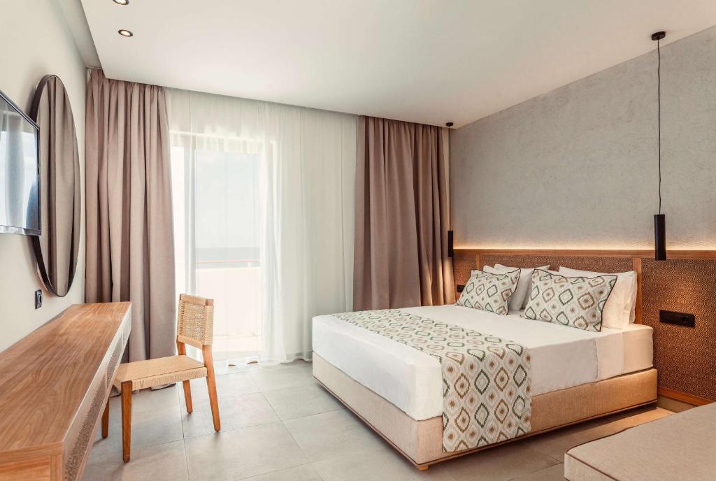 A bed or beds in a room at Blue Sea Island