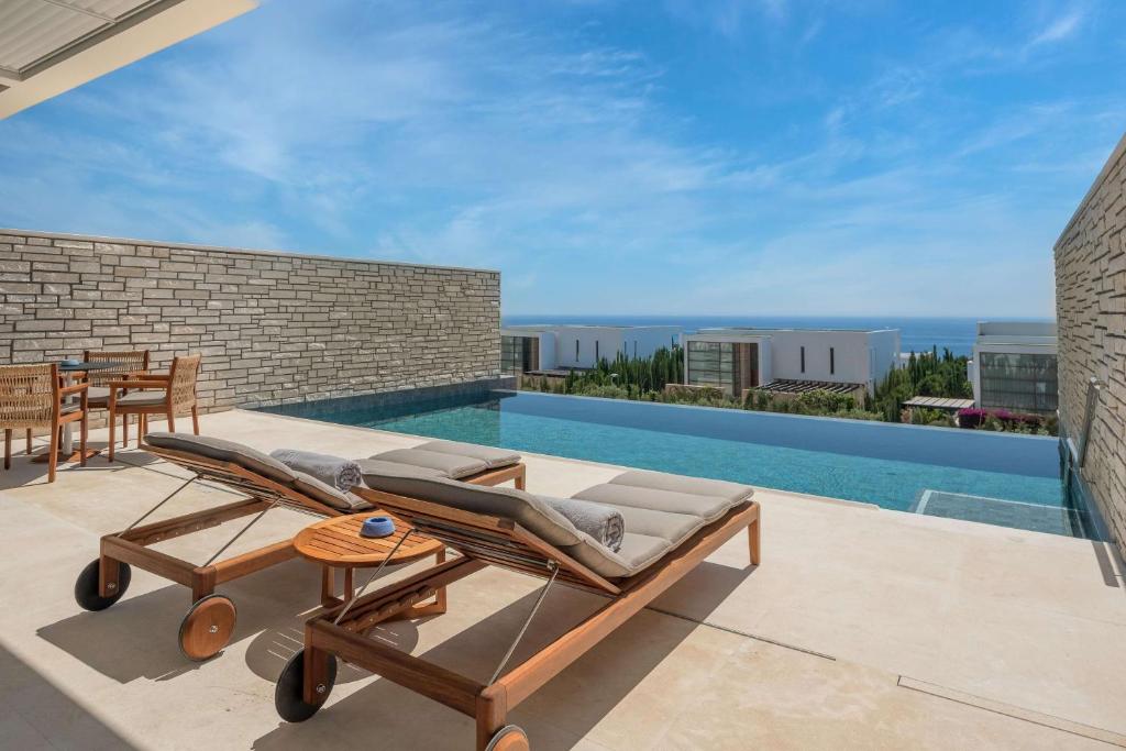 a view of a swimming pool from a house at Cap St Georges Hotel & Resort in Peyia