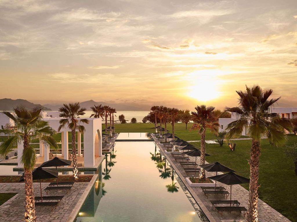 a rendering of a resort with palm trees and a pool at Grecotel Casa Marron in Kalamákion