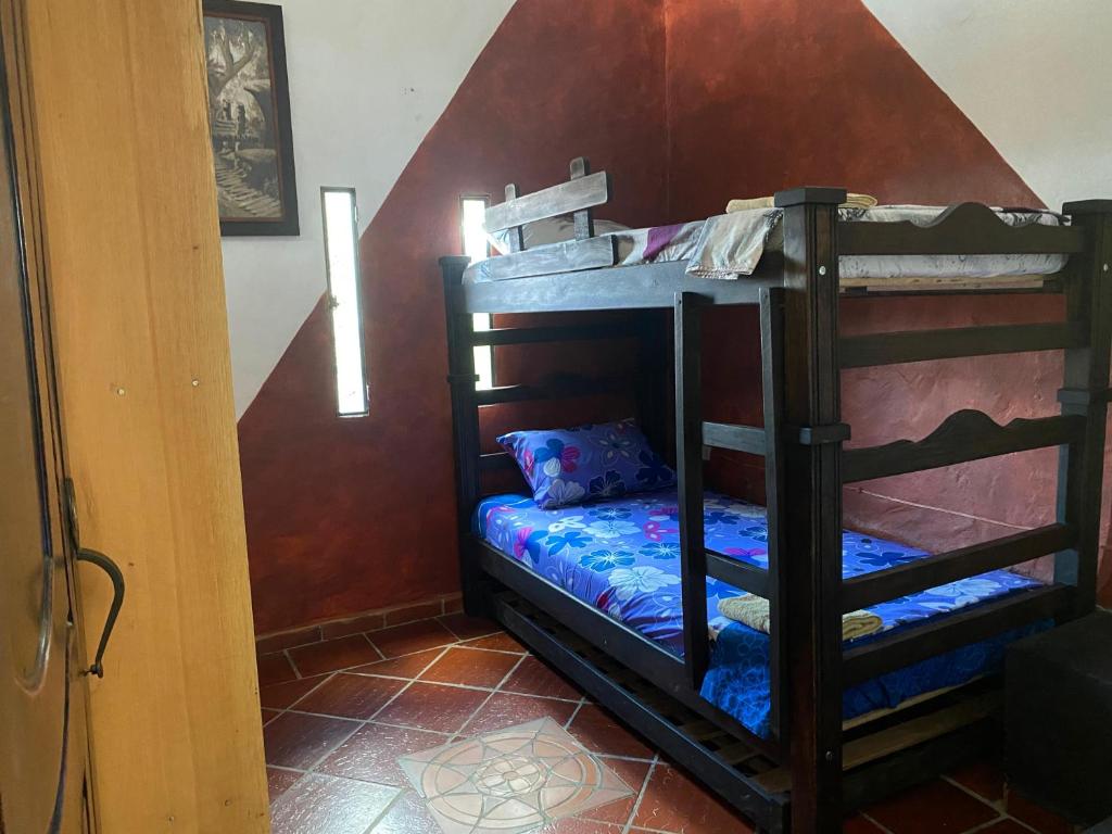 Postel nebo postele na pokoji v ubytování Cabañas Cañon Del Chicamocha