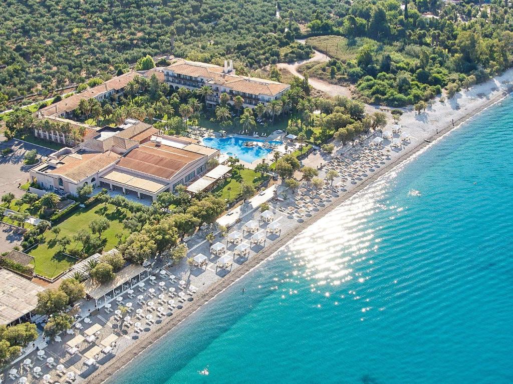 an aerial view of a resort next to the water at Grecotel Filoxenia Hotel in Kalamata