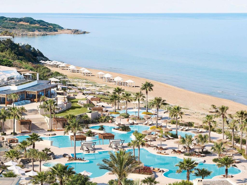 an aerial view of the resort and the beach at Grecotel La Riviera & Aqua Park in Loutra Killinis