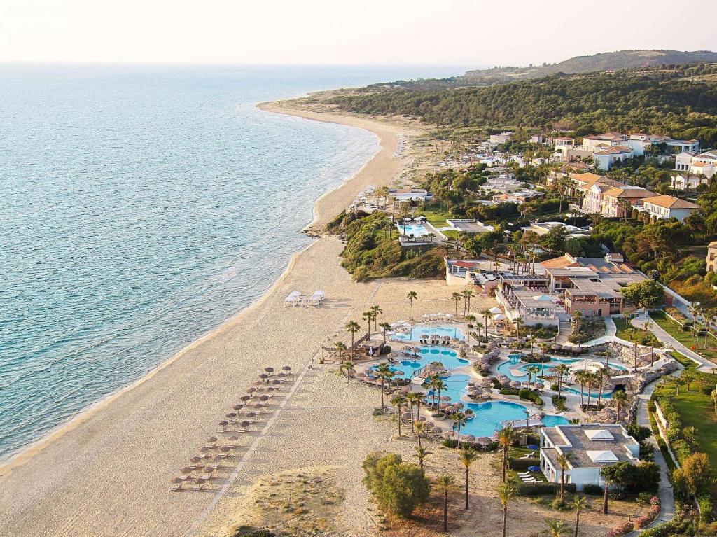 an aerial view of a resort and the beach at Grecotel Olympia Oasis & Aqua Park in Loutra Killinis
