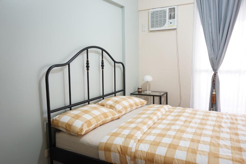 מיטה או מיטות בחדר ב-Alea Residences