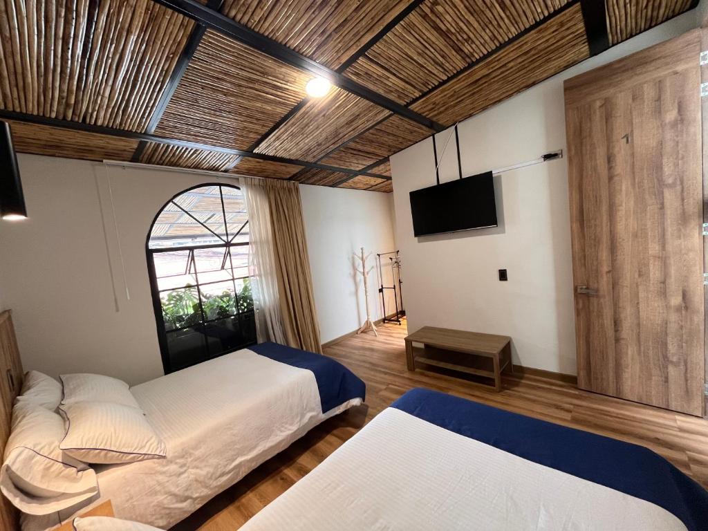 Postel nebo postele na pokoji v ubytování Casa 121, calle 121 no 7-18