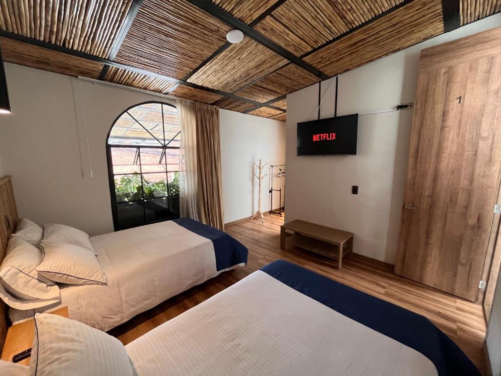 Postel nebo postele na pokoji v ubytování Casa 121, calle 121 no 7-18
