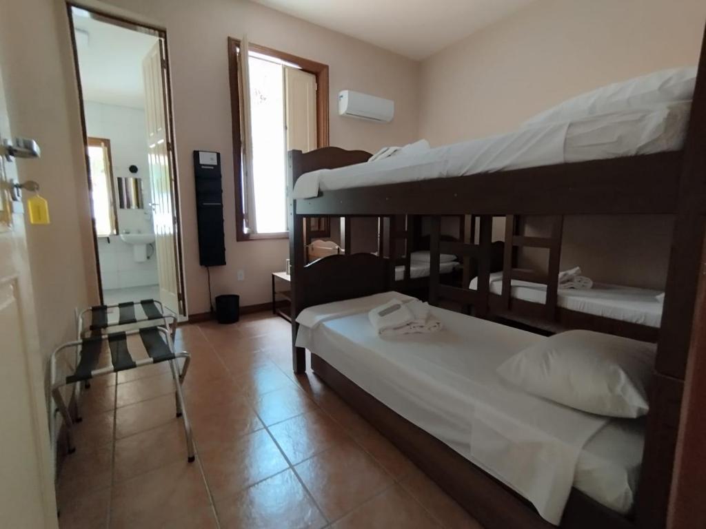 Postel nebo postele na pokoji v ubytování Casa das Luzes Hostel IVN
