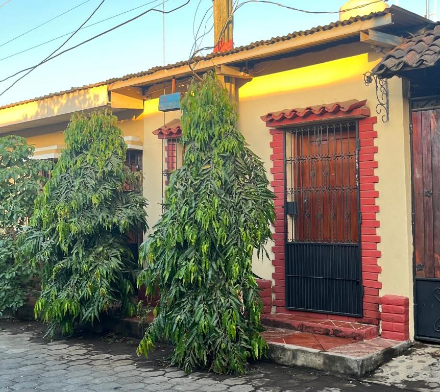 a house with three trees in front of it at Apartamento Los Monges in León