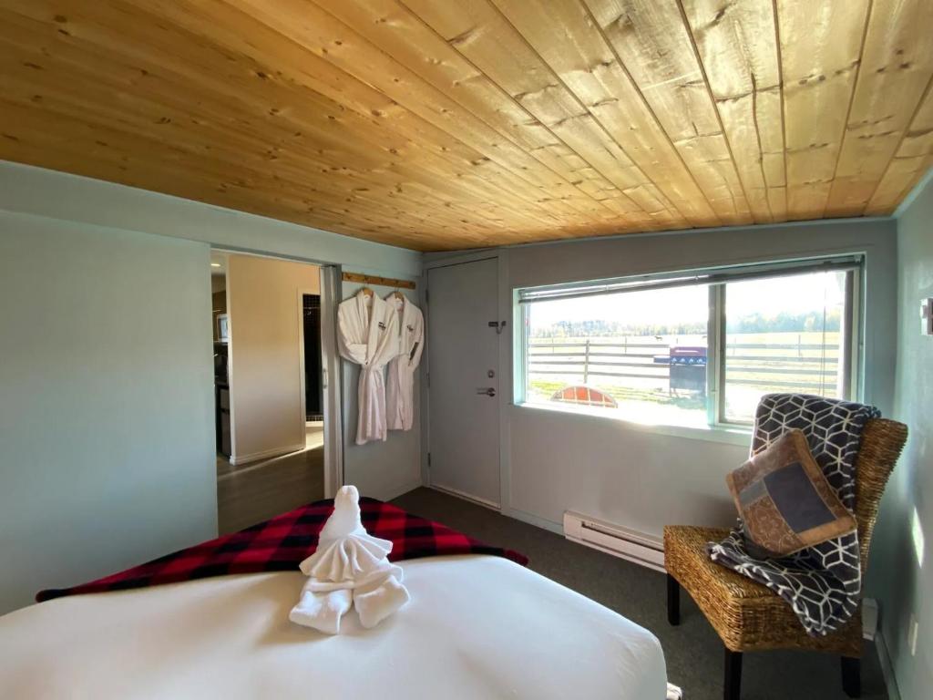 Voodi või voodid majutusasutuse Woodhouse Cottages And Ranch toas