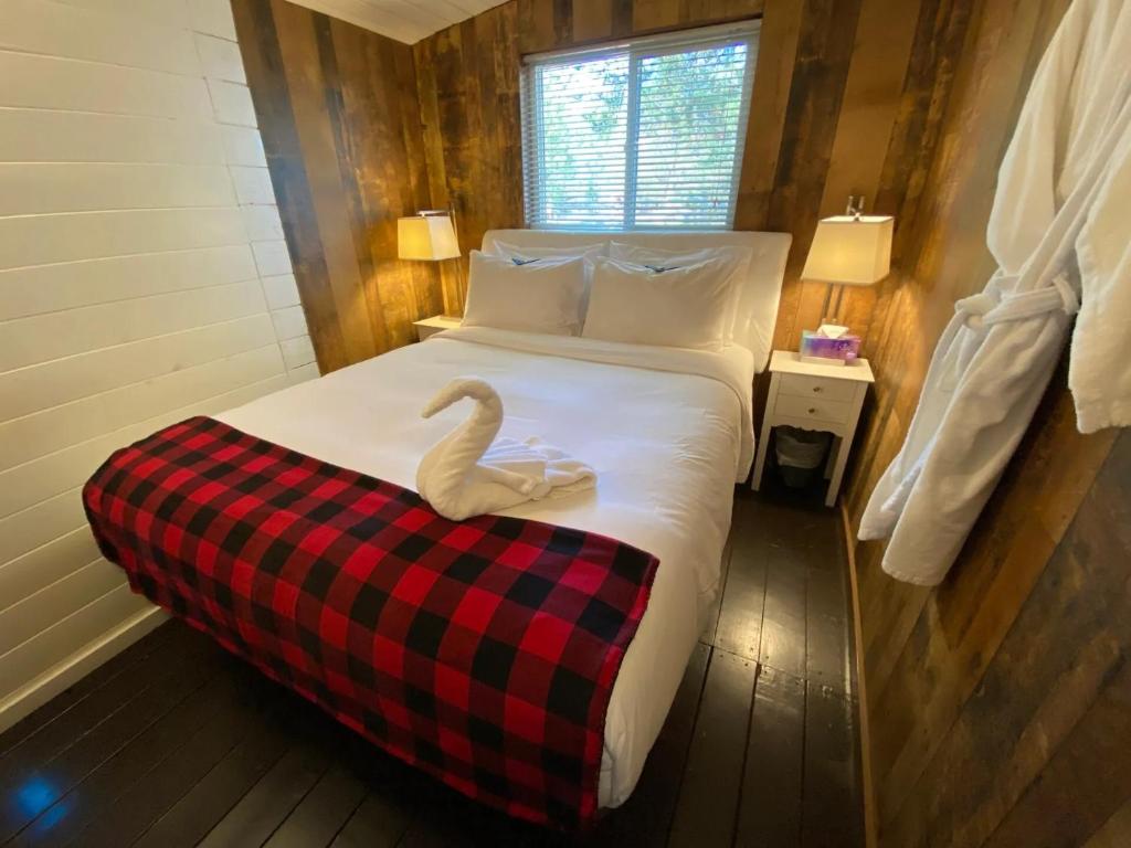 Voodi või voodid majutusasutuse Woodhouse Cottages And Ranch toas