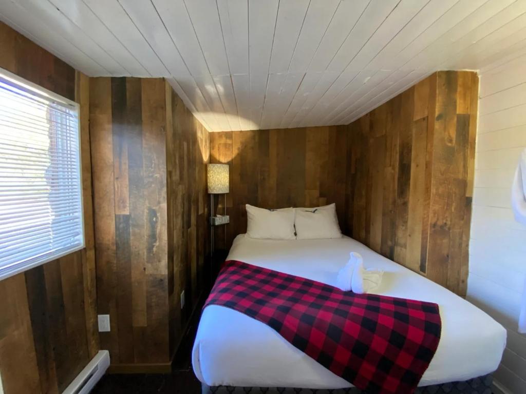 Voodi või voodid majutusasutuse Woodhouse Cottages And Ranch toas