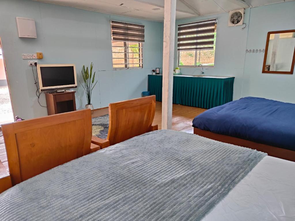 Кровать или кровати в номере Homestay Teratak D`kemangi with Private Pool