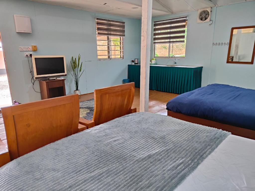 Voodi või voodid majutusasutuse Homestay Teratak D`kemangi with Private Pool toas