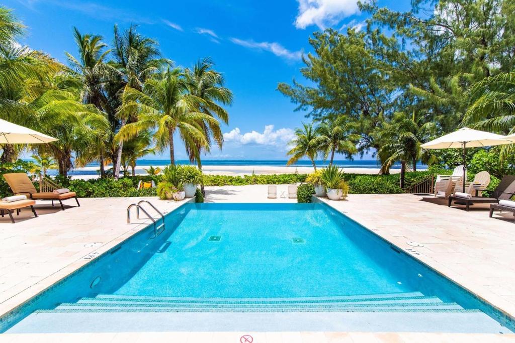 an image of a swimming pool at a resort at Moon Kai home in Driftwood Village