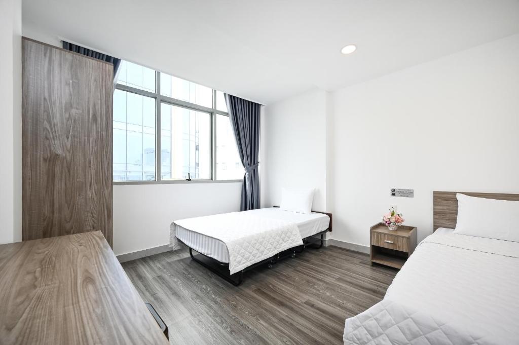 YoKo Airport Saigon Hotel - Deluxe Triple Room Com Vista Da Cidade