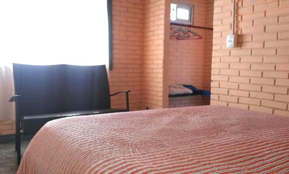 Postel nebo postele na pokoji v ubytování El Mangrullo