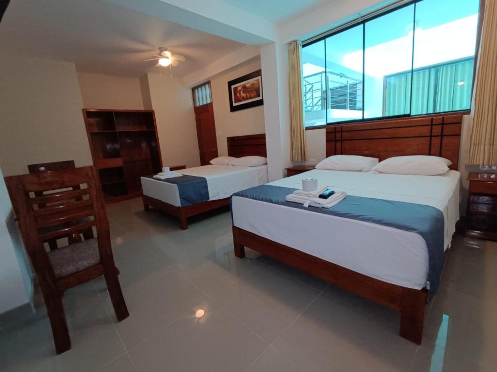 Posteľ alebo postele v izbe v ubytovaní Hotel Inambari Golden