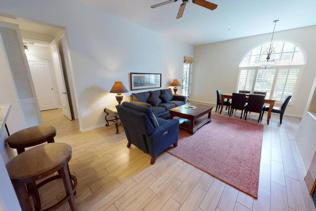 a living room with a couch and a table at LV101 Downstairs 1 Bedroom Legacy Villas Retreat in La Quinta