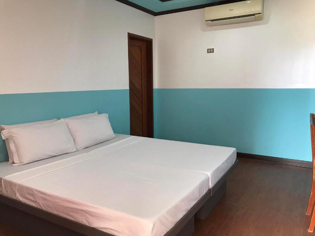 Postel nebo postele na pokoji v ubytování SG Hotel