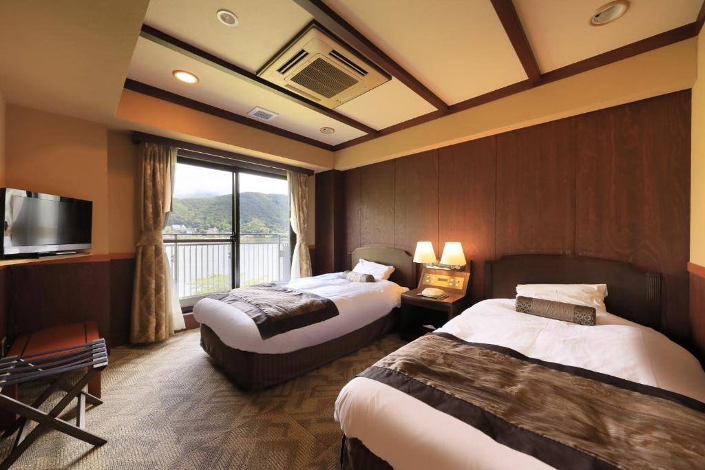 Postel nebo postele na pokoji v ubytování Fuji Lake Hotel
