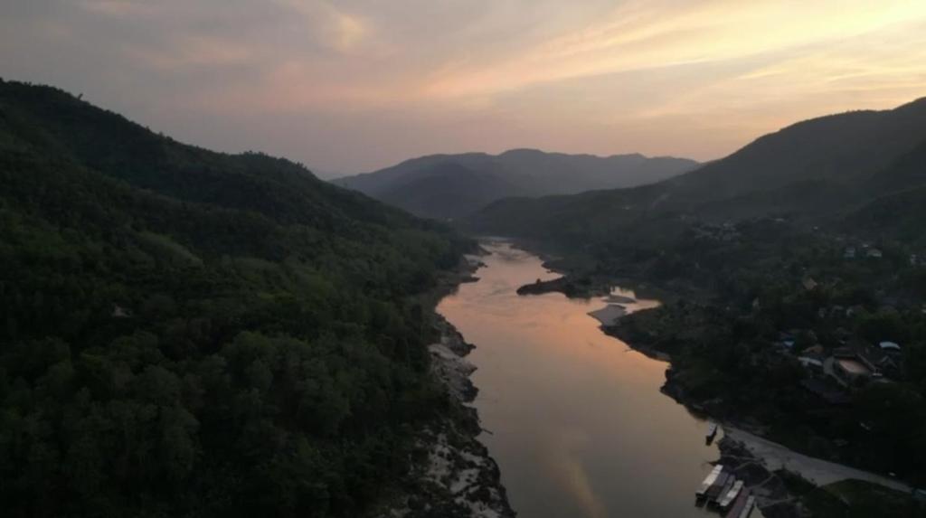 an aerial view of a river in a valley at Janh Ya phone Guesthouse in Pakbeng