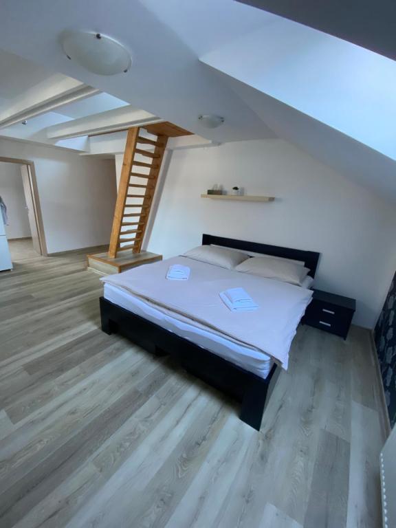 A bed or beds in a room at Ager Apartments
