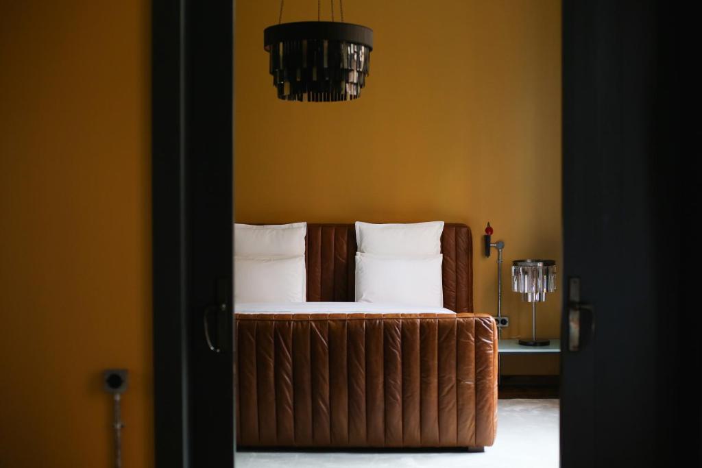 Postel nebo postele na pokoji v ubytování Stamba Hotel