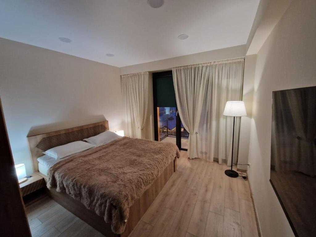 Postel nebo postele na pokoji v ubytování Cozy House New Gudauri