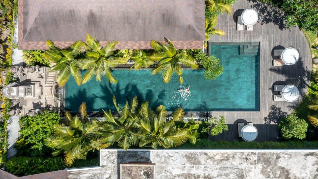 Bazén v ubytování The Hava Ubud A Pramana Experience nebo v jeho okolí