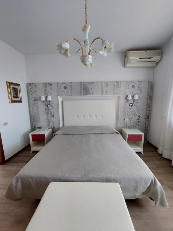Postel nebo postele na pokoji v ubytování Albergo Alla Pineta